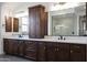 Bathroom features a double sink vanity with dark cabinets and marble countertops at 20775 W Rattler Rd, Buckeye, AZ 85396