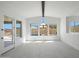 Bright dining area with large windows providing natural light and scenic views of the outdoor pool at 20775 W Rattler Rd, Buckeye, AZ 85396