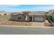 Stunning single-Gathering home with a tile roof, paver driveway, and desert-style landscaping at 20775 W Rattler Rd, Buckeye, AZ 85396