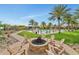 Relaxing fire pit surrounded by Adirondack chairs, part of a community recreation area at 20775 W Rattler Rd, Buckeye, AZ 85396