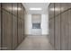 Garage area featuring gray wood-tone cabinets on walls, epoxy floors and equipment at 20775 W Rattler Rd, Buckeye, AZ 85396