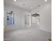Bright open concept living area with recessed lighting and tiled floors at 20775 W Rattler Rd, Buckeye, AZ 85396