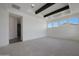 Open-concept living area with decorative ceiling beams and recessed lighting at 20775 W Rattler Rd, Buckeye, AZ 85396
