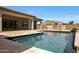 Beautiful backyard pool and spa area with an outdoor kitchen perfect for summer gatherings at 20775 W Rattler Rd, Buckeye, AZ 85396