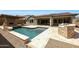 Beautiful backyard pool and spa area with an outdoor kitchen perfect for summer gatherings at 20775 W Rattler Rd, Buckeye, AZ 85396
