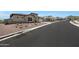 Street view of a charming home with desert landscaping, and an attached garage at 20775 W Rattler Rd, Buckeye, AZ 85396