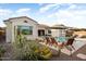 Charming backyard with a pool, lounge chairs, desert landscaping, and an outdoor grill at 20977 W Mariposa St, Buckeye, AZ 85396