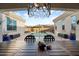 Beautiful backyard featuring a sparkling pool, outdoor seating, and stylish landscaping at 20977 W Mariposa St, Buckeye, AZ 85396