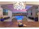 Stunning backyard featuring a sparkling pool, outdoor seating, and stylish landscaping at 20977 W Mariposa St, Buckeye, AZ 85396