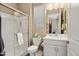 Well-lit bathroom with a glass-enclosed shower, modern vanity, and neutral color palette at 20977 W Mariposa St, Buckeye, AZ 85396