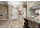 Bright foyer with elegant tile flooring, a decorative table, and views into other rooms at 20977 W Mariposa St, Buckeye, AZ 85396