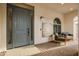 Inviting front porch with comfortable seating and stylish decor, enhanced by a patterned rug at 20977 W Mariposa St, Buckeye, AZ 85396