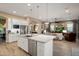 Spacious kitchen featuring a center island, stainless steel appliances, and an open layout for entertaining at 20977 W Mariposa St, Buckeye, AZ 85396
