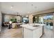 Bright kitchen featuring a large island, stainless steel appliances, and an open layout for entertaining at 20977 W Mariposa St, Buckeye, AZ 85396