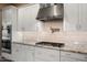 Well-equipped kitchen with stainless steel appliances, granite countertops, and stylish subway tile backsplash at 20977 W Mariposa St, Buckeye, AZ 85396