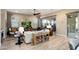 Cozy living room featuring a comfortable sofa, a ceiling fan, and sliding glass doors to the patio at 20977 W Mariposa St, Buckeye, AZ 85396