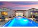 Stunning backyard pool area with outdoor dining and inviting lounge spaces, perfect for entertaining at 20977 W Mariposa St, Buckeye, AZ 85396