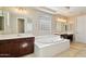 Spacious bathroom features dual vanities, soaking tub and tile flooring at 2270 E Honeysuckle Pl, Chandler, AZ 85249