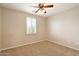 Bedroom features a fan, shuttered window, and carpeted floors at 2270 E Honeysuckle Pl, Chandler, AZ 85249