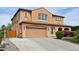 Exterior of two-story home with beige stucco, tile roof, manicured lawn, and a two-car garage at 2270 E Honeysuckle Pl, Chandler, AZ 85249