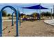 Vibrant community playground with various play structures, swing sets, and soft ground covering at 2270 E Honeysuckle Pl, Chandler, AZ 85249