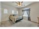 Comfortable bedroom with carpet, decorative windows, and a cozy bed with decorative pillows at 2600 E Springfield Pl # 58, Chandler, AZ 85286