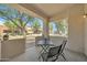 Charming covered patio with seating, offering a view of the community at 2600 E Springfield Pl # 58, Chandler, AZ 85286