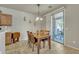 Inviting dining area featuring a wooden table, chairs, and sliding glass doors to the outdoor patio at 2600 E Springfield Pl # 58, Chandler, AZ 85286