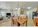 Open dining area with views into the kitchen, living room, and the backyard at 2600 E Springfield Pl # 58, Chandler, AZ 85286