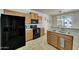 Bright kitchen showcasing modern appliances, wooden cabinets and granite countertops at 2600 E Springfield Pl # 58, Chandler, AZ 85286