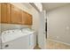 Functional laundry room with washer, dryer, and ample cabinet storage at 2600 E Springfield Pl # 58, Chandler, AZ 85286