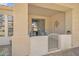 Enclosed patio with a seating area and privacy gate, extending the living space outdoors at 2600 E Springfield Pl # 58, Chandler, AZ 85286