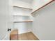 Organized walk-in closet with shelves and carpet, providing ample storage space at 2600 E Springfield Pl # 58, Chandler, AZ 85286