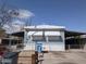 Single story home featuring desert landscaping, awnings, and concrete driveway at 2630 E Beverly Ln, Phoenix, AZ 85032