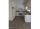 Charming kitchen offering white cabinets, modern appliances, and functional layout at 2630 E Beverly Ln, Phoenix, AZ 85032