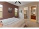 This bedroom features an ensuite bathroom, carpet, and walls of calming neutral colors for ultimate relaxation at 26473 W Runion Ln, Buckeye, AZ 85396