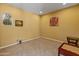 Versatile bonus room with neutral carpet and natural light, ideal for a home office or playroom at 26473 W Runion Ln, Buckeye, AZ 85396