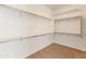 Walk-in closet with ample shelving and rod space, perfect for organized storage at 26473 W Runion Ln, Buckeye, AZ 85396