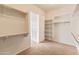 Spacious walk-in closet with shelving and rod space, providing ample storage at 26473 W Runion Ln, Buckeye, AZ 85396