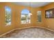 Dining area with tile floors, sunny windows and neutral paint at 26473 W Runion Ln, Buckeye, AZ 85396