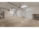 Large garage with built-in cabinets and overhead storage for bikes and other sporting goods at 26473 W Runion Ln, Buckeye, AZ 85396