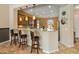 Kitchen view with breakfast bar, granite countertops, and pendant lighting at 26473 W Runion Ln, Buckeye, AZ 85396