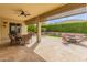 Covered patio with ceiling fan and full outdoor furniture set at 26473 W Runion Ln, Buckeye, AZ 85396