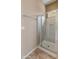 Modern glass shower features a built-in seat, niche, and chrome fixtures at 26473 W Runion Ln, Buckeye, AZ 85396