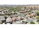 Neighborhood view of a desert home with manicured desert landscaping and red tile roofs at 28942 N Lazurite Way, San Tan Valley, AZ 85143