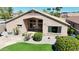 Desert home with grass patch, flagstone, grill and patio furniture in the backyard at 28942 N Lazurite Way, San Tan Valley, AZ 85143