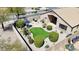 Backyard features artificial turf, a stone patio, desert landscaping and outdoor seating area at 28942 N Lazurite Way, San Tan Valley, AZ 85143