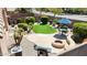 Backyard features artificial turf, a stone patio, desert landscaping, outdoor seating and BBQ at 28942 N Lazurite Way, San Tan Valley, AZ 85143