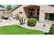 Desert home with grass patch, flagstone, grill and patio furniture in the backyard at 28942 N Lazurite Way, San Tan Valley, AZ 85143