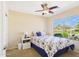 Bright bedroom showcasing a floral-patterned bed, a large window with outdoor views, and neutral-toned walls at 28942 N Lazurite Way, San Tan Valley, AZ 85143